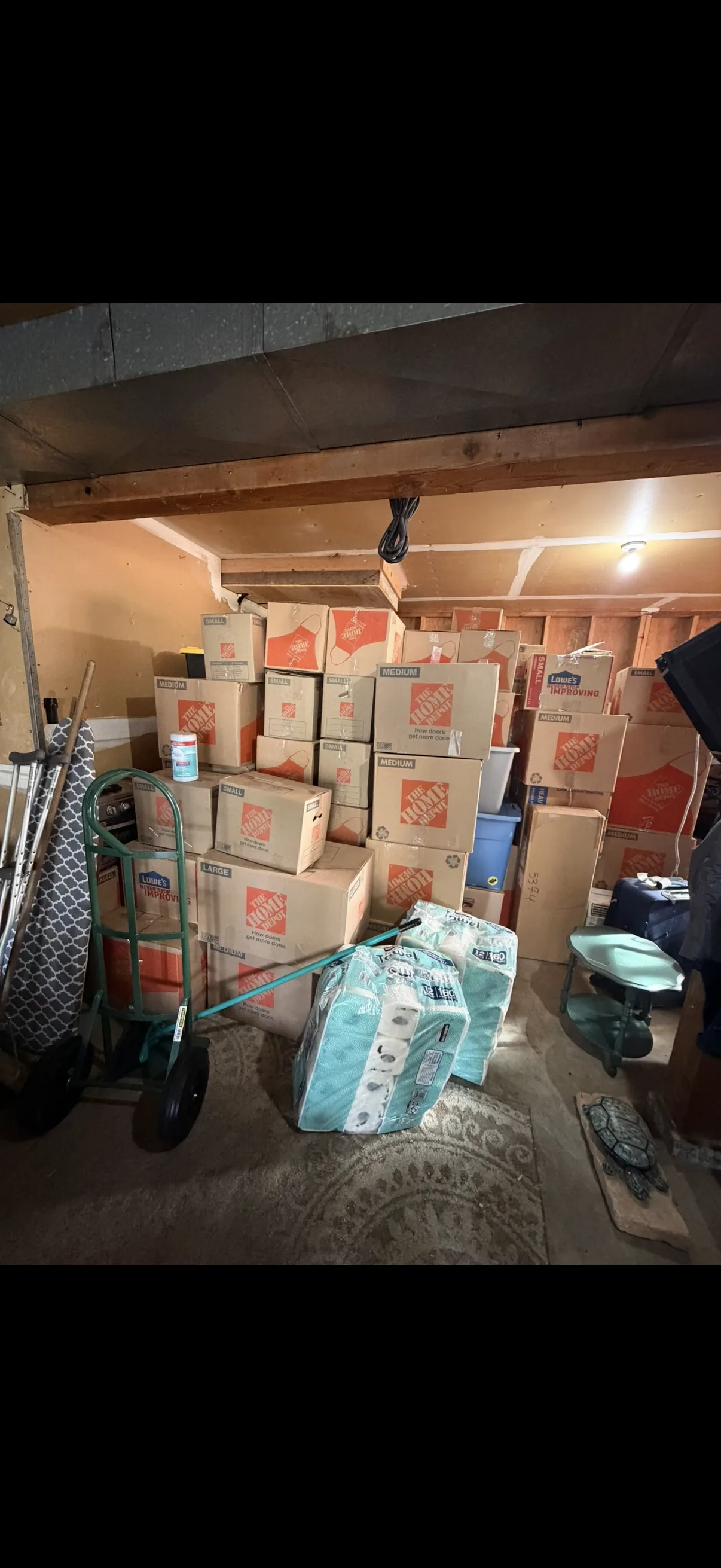 Packed boxes and furniture staged for loading